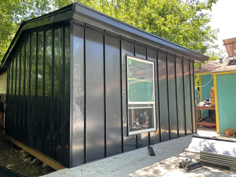 Black standing seam metal wall panels for Roof Inspection in Lake Hallie