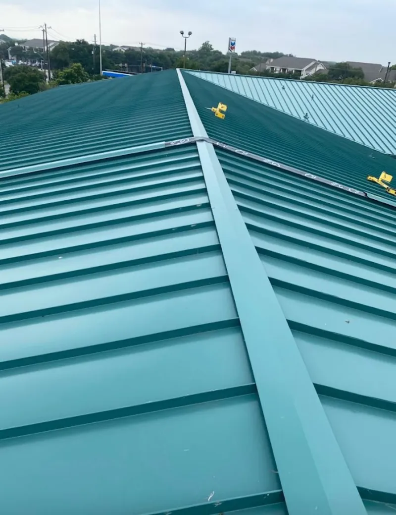 Green commercial metal roof ridge and valley for Metal Roof Repair in Lake Hallie
